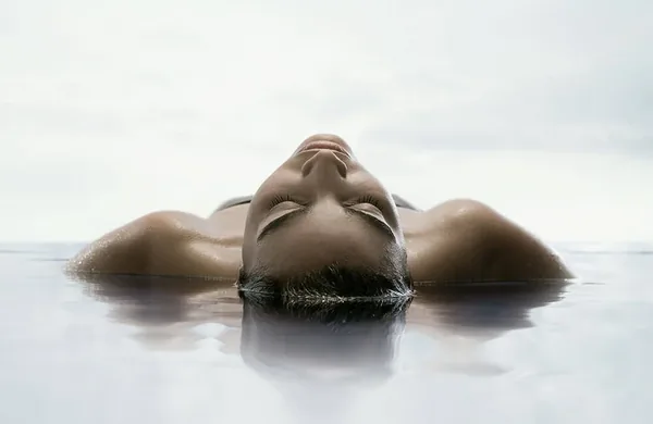 Person relaxing during float therapy