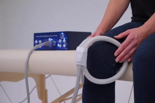 PEMF therapy coil applied to a knee